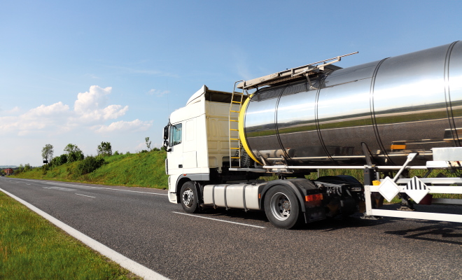 A big fuel tanker truck driving on road